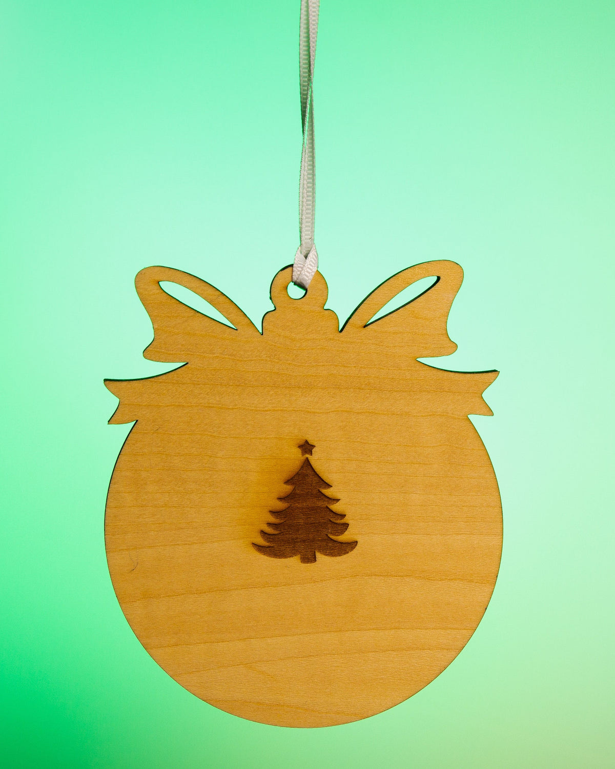 Back of 2026 natural wood Merry Christmas photo magnet ornament showing removable magnet hardware