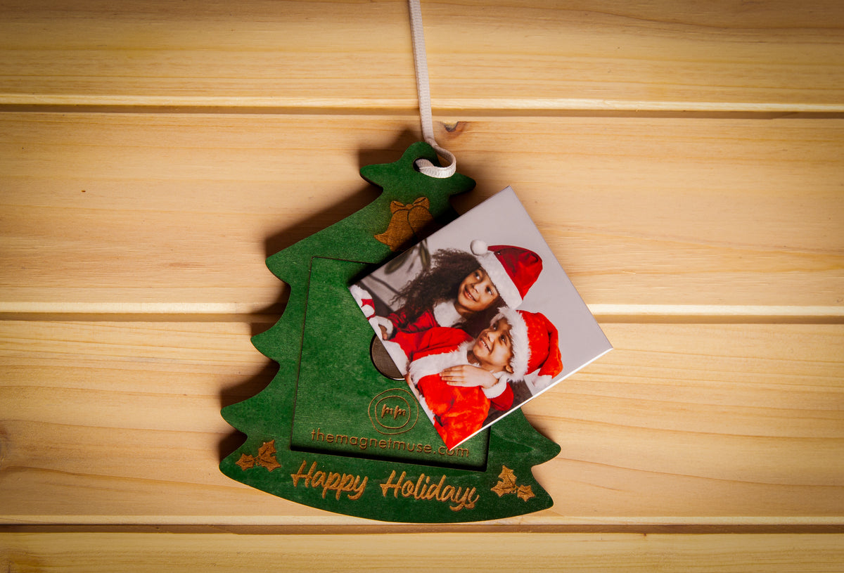 Removable custom photo magnet shown outside a green Christmas tree ornament