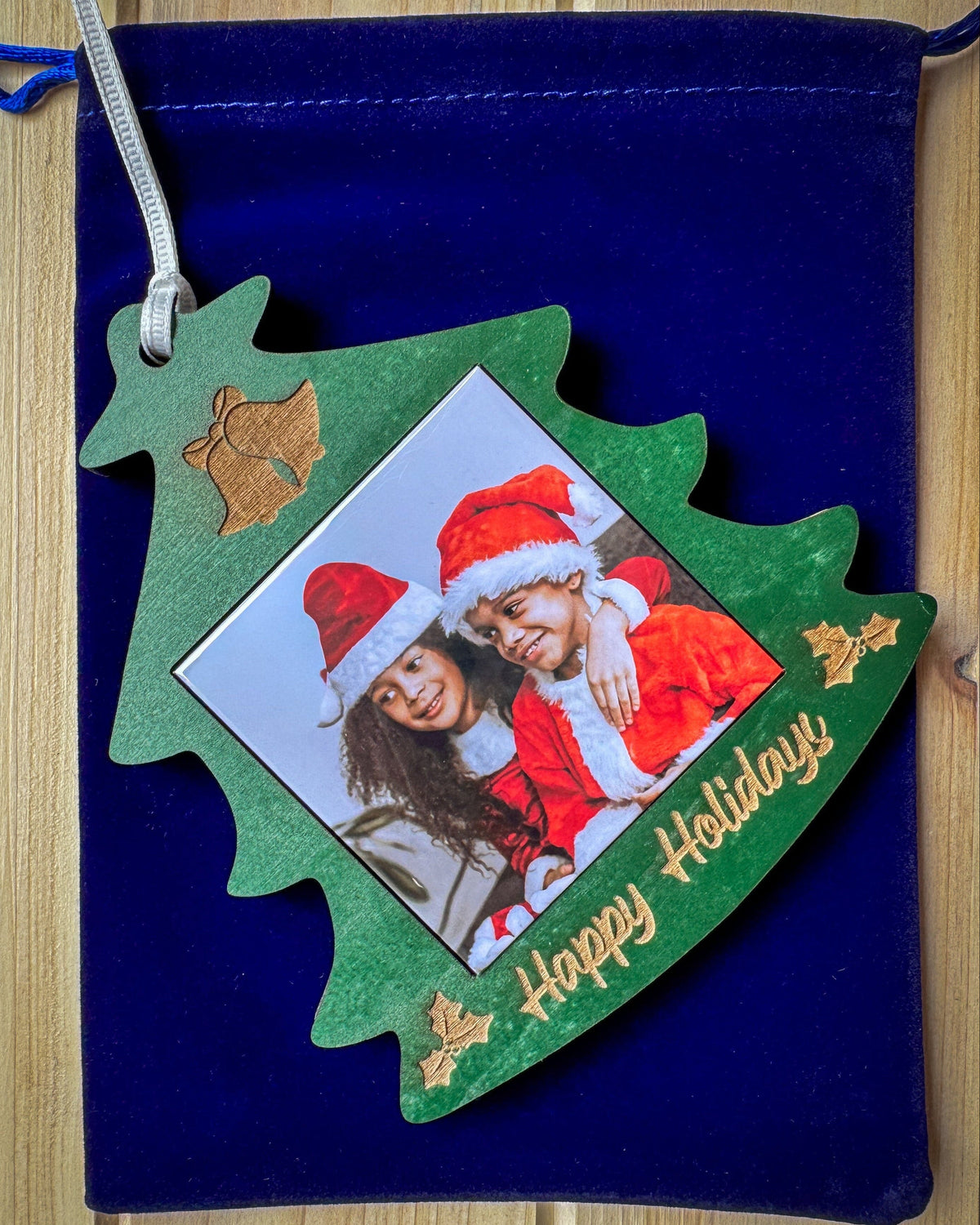 Green Christmas tree photo magnet ornament displayed with giftable packaging