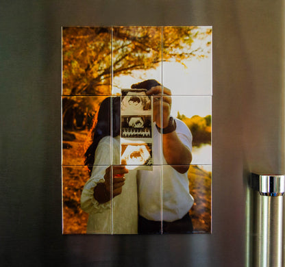 Couple holding baby announcement in custom photo magnet puzzle