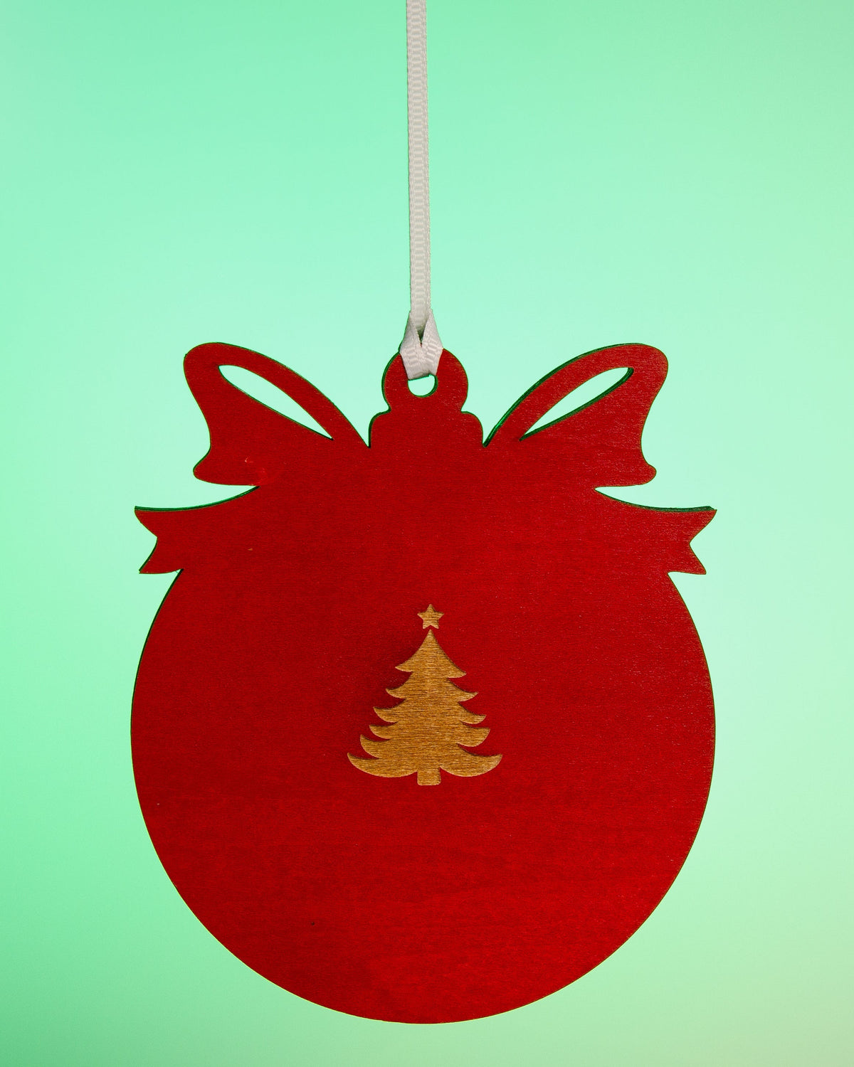 Back of red Merry Christmas photo magnet ornament showing removable magnet hardware